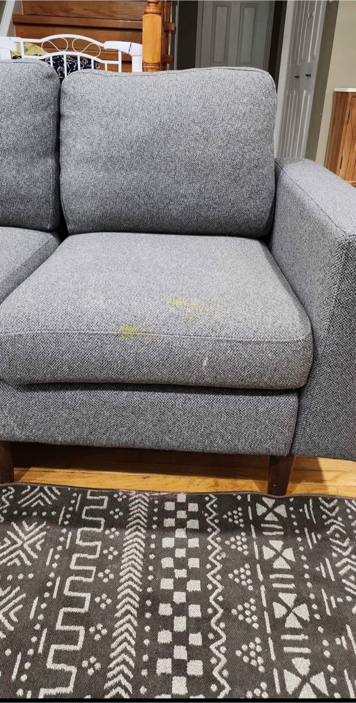 A Grey Sectional Sofa with Ottoman