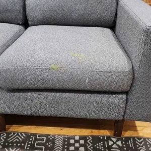 A single Grey Sectional Sofa