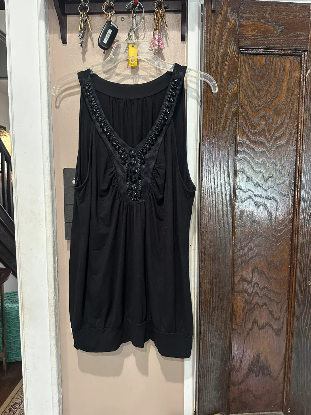 Black sleeveless embellished V-neck top