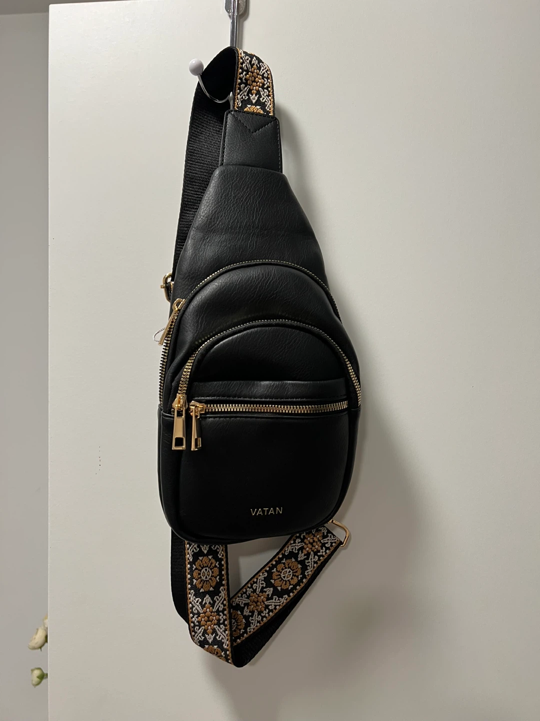 Black faux leather sling bag