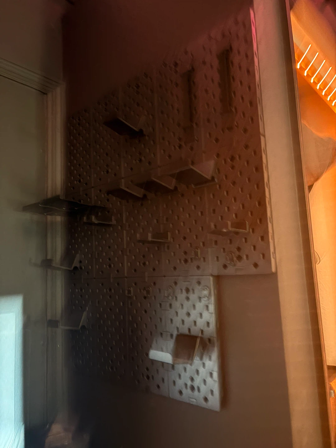 Pegboard with Assorted Hooks and Shelves