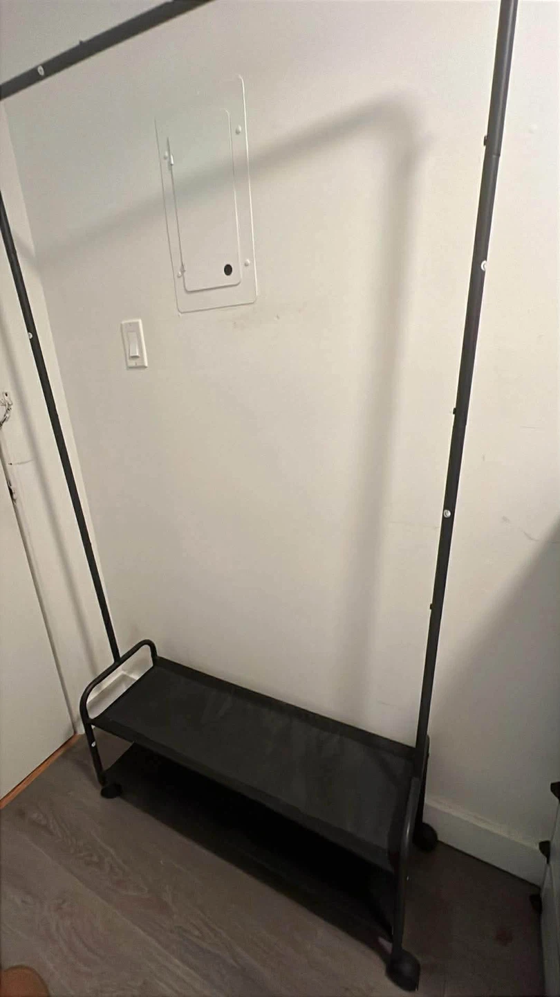 Black Metal Garment Rack, floor lamp and book shelf