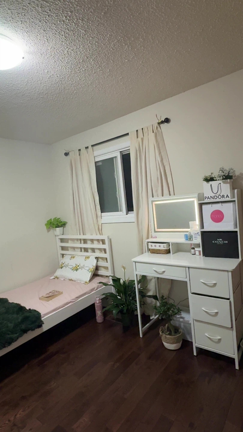 White vanity with lighted mirror and drawers
