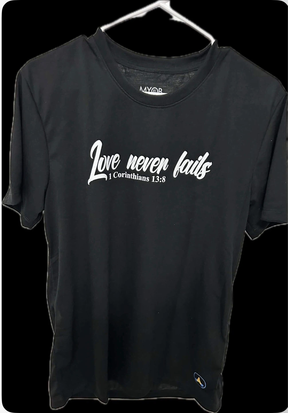 “Love Never Fails" T-Shirt