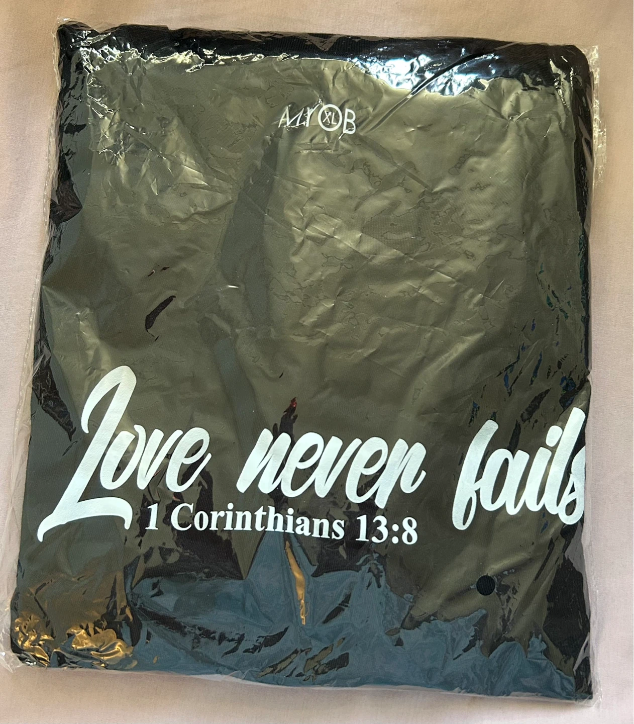 “Love Never Fails" T-Shirt - photo 2