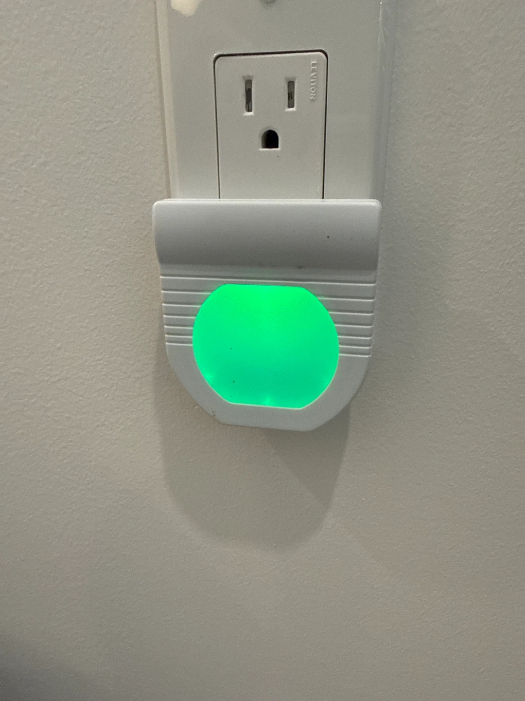 White Plug-in Night Light with Green Glow
