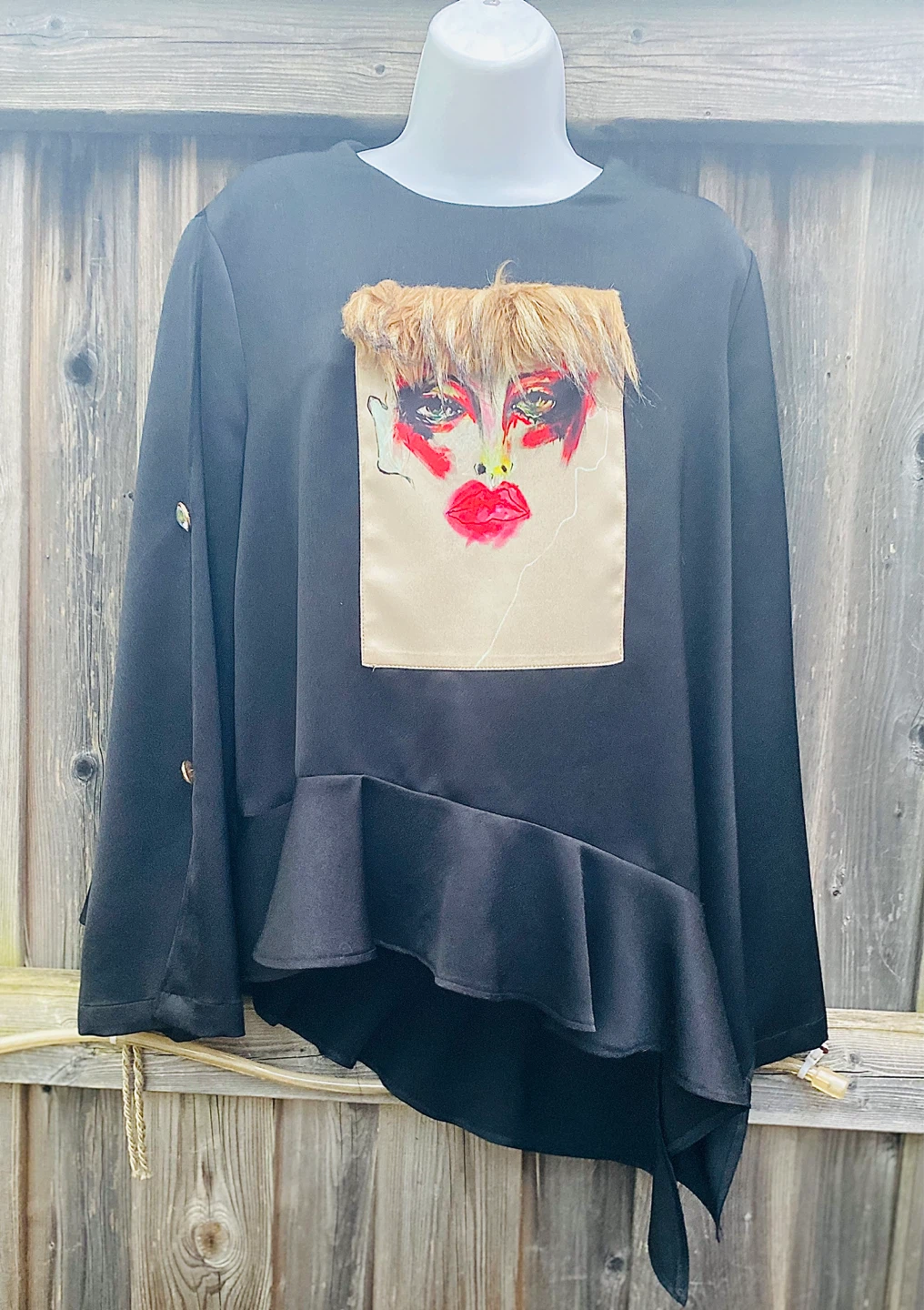 Black Statement Top with Face Graphic and Ruffle Hem