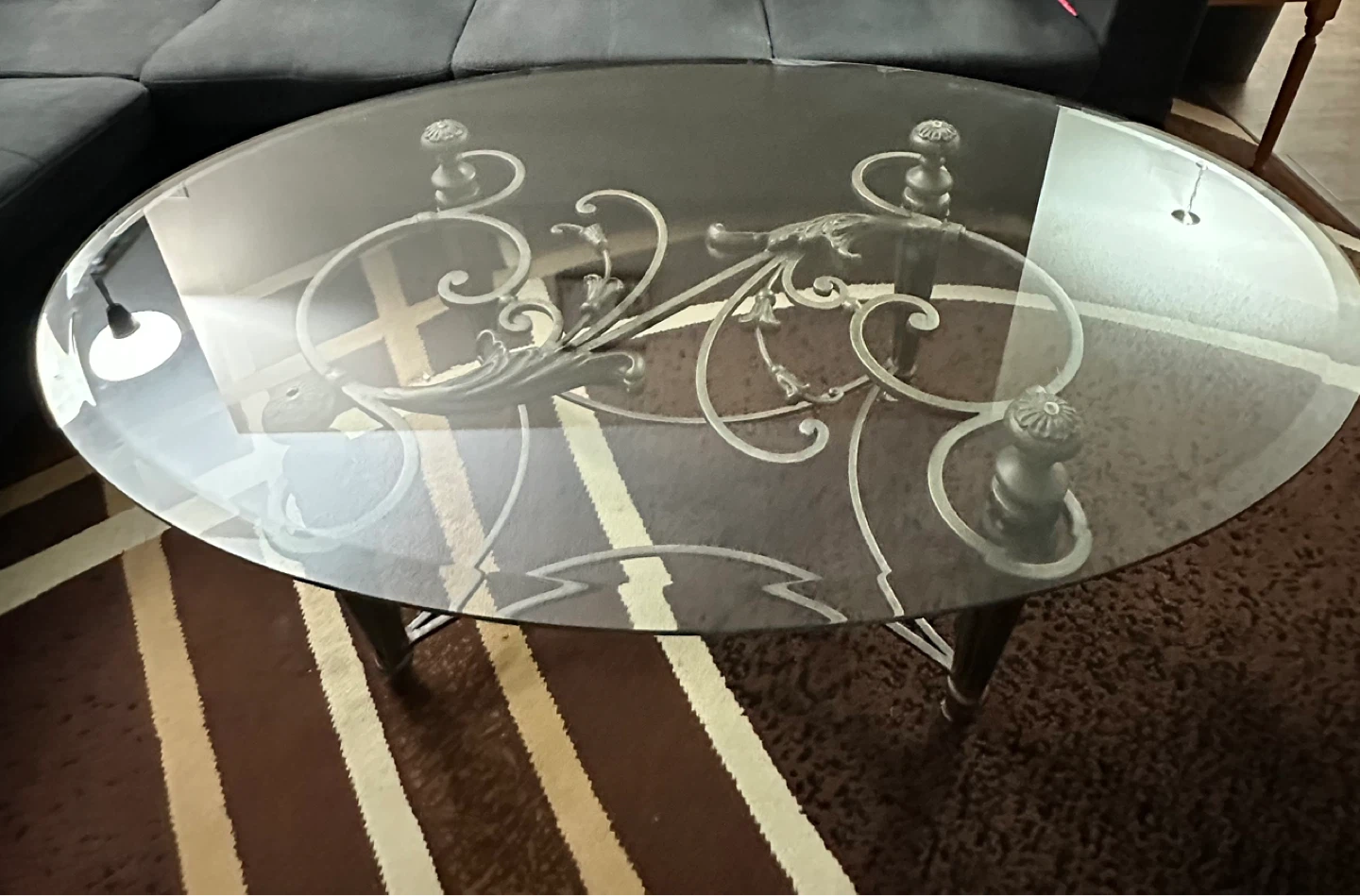 Oval Glass Coffee Table with Ornate Metal Base
