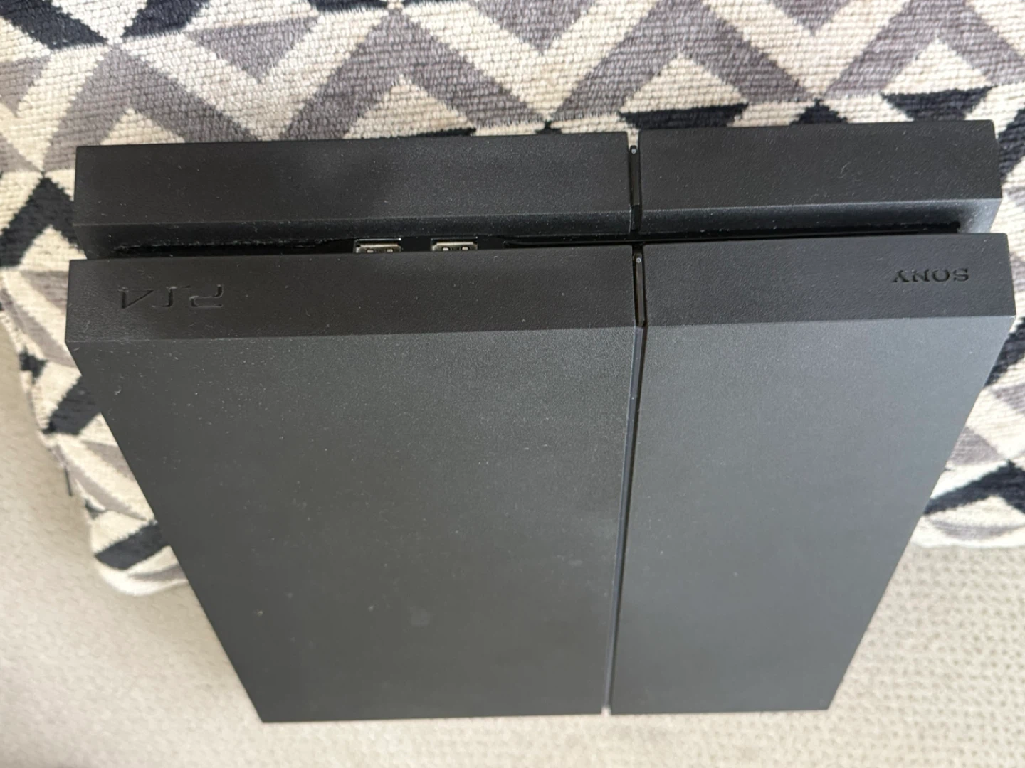 Sony PlayStation 4 Console with Two Controllers