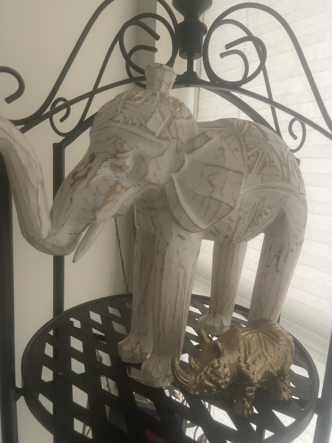 Carved wooden elephant and rhinoceros decorative figures