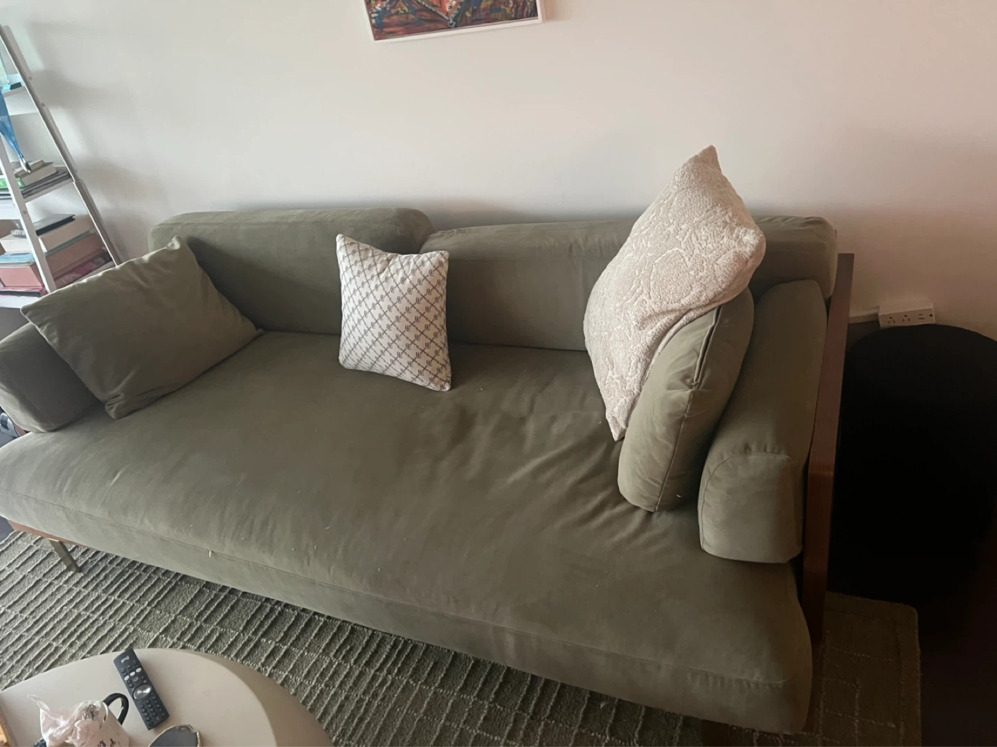Green Sofa with Throw Pillows