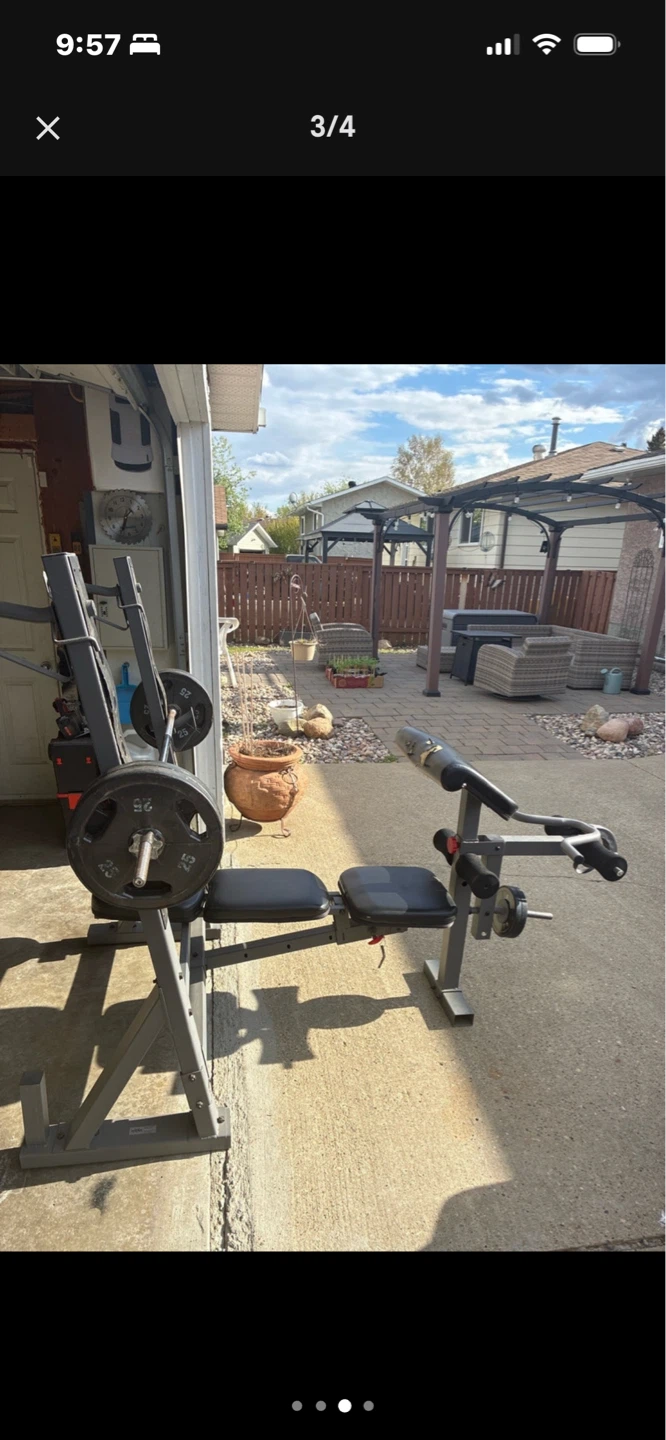 Weight Bench with Barbell and Weights