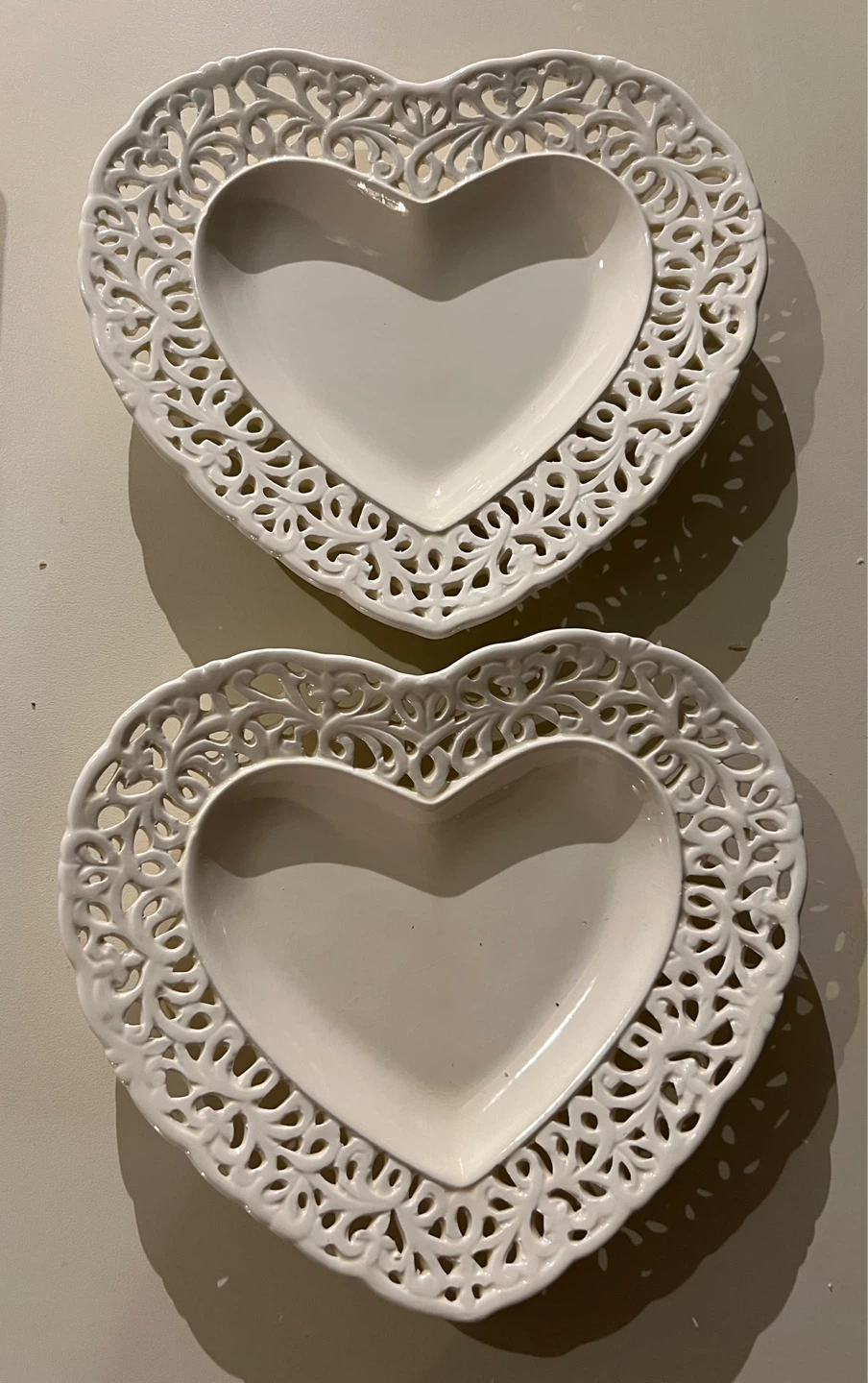 Pair of white ceramic heart-shaped plates