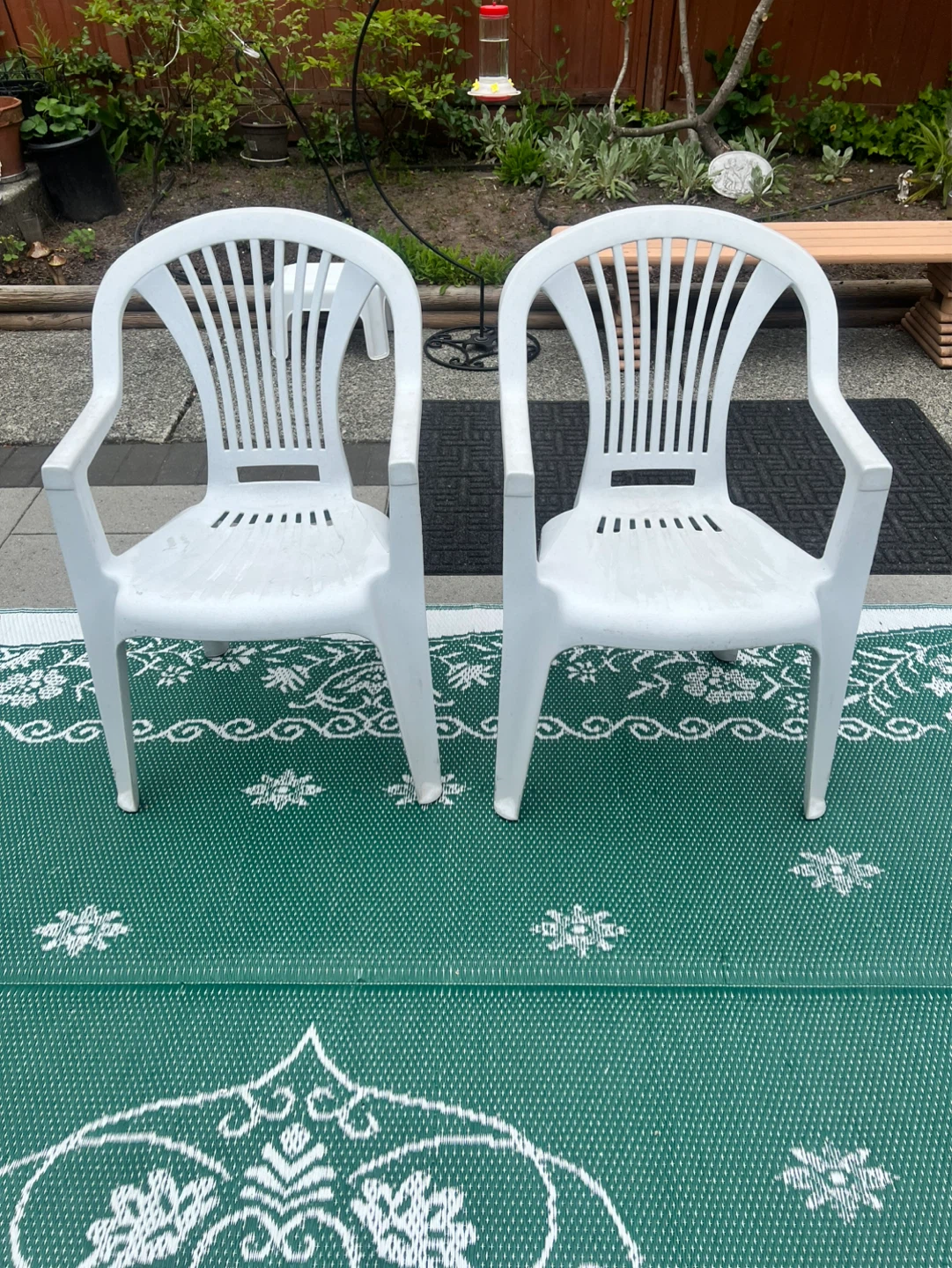 Two White Plastic Patio Chairs