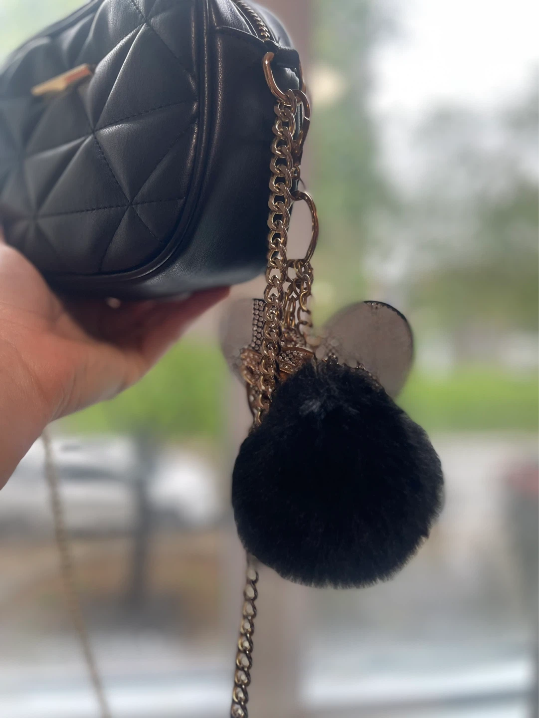 Black quilted crossbody bag with charms - photo 3