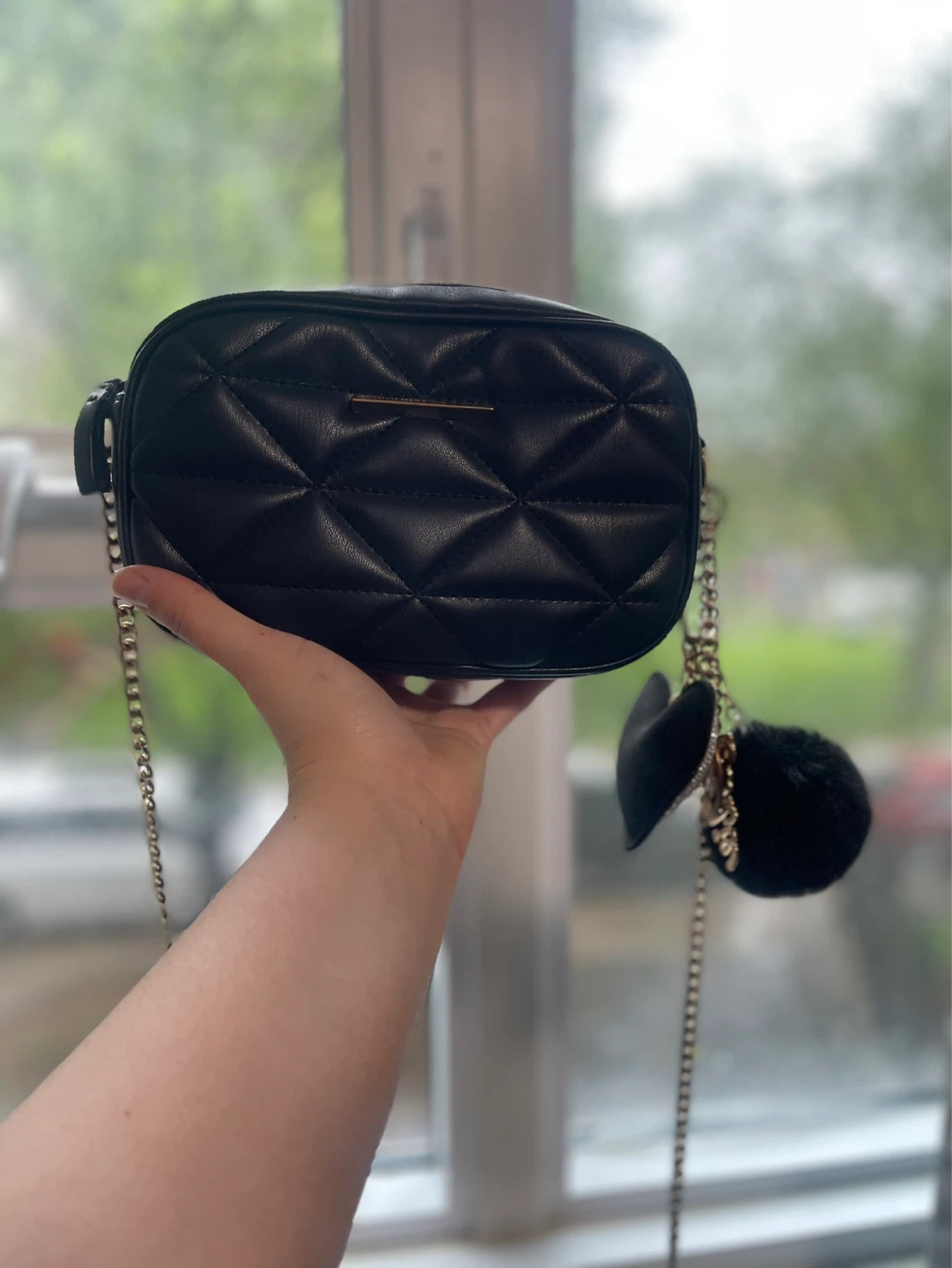 Black quilted crossbody bag with charms - photo 2