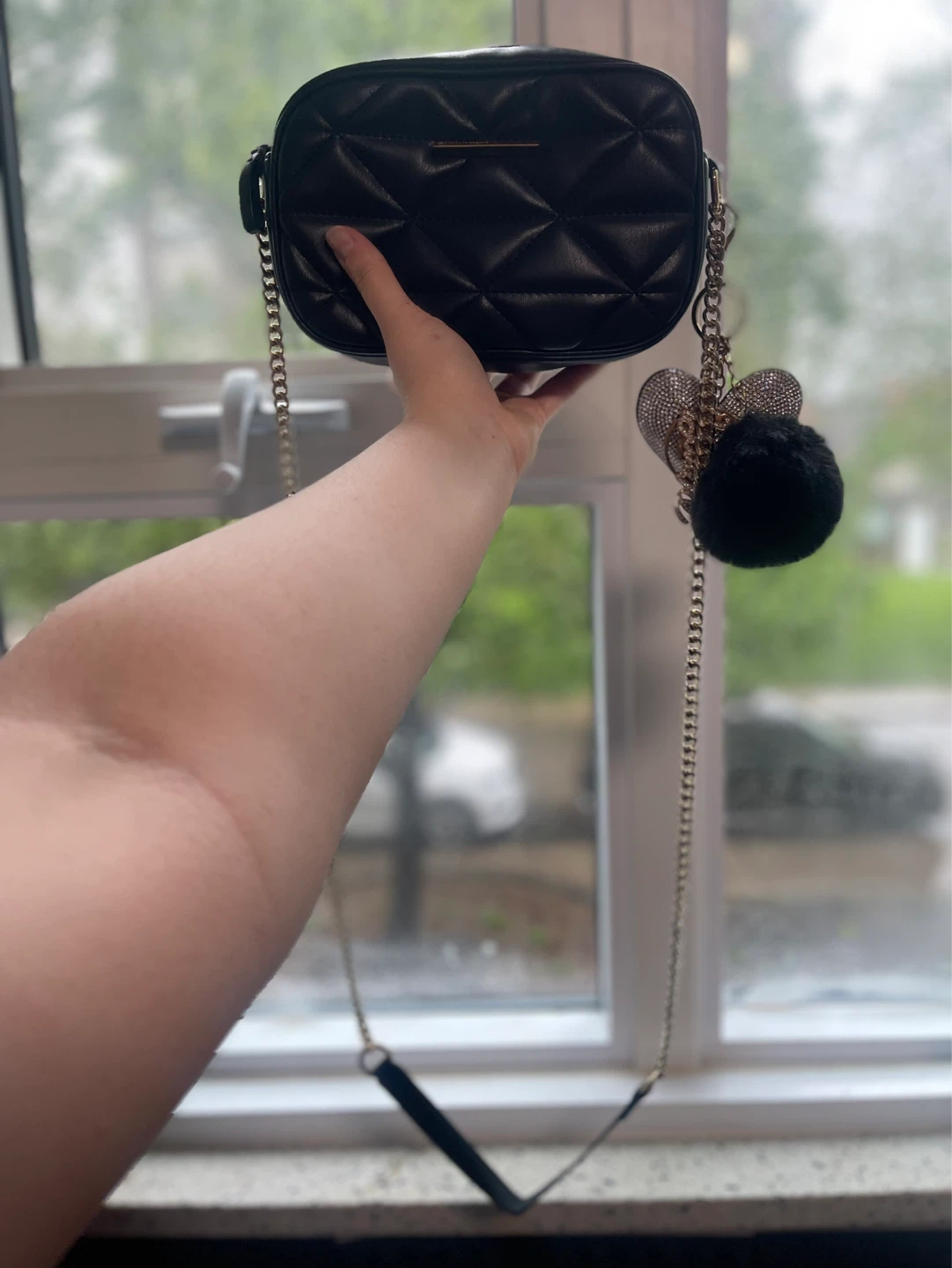 Black quilted crossbody bag with charms - photo 4