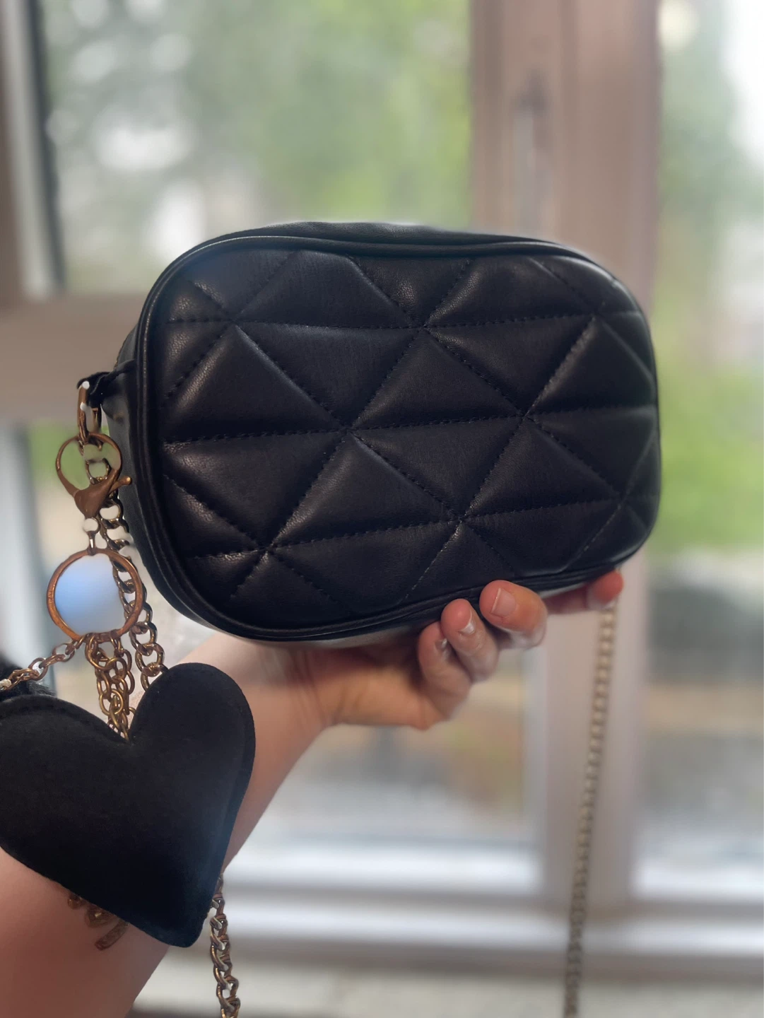 Black quilted crossbody bag with charms - photo 5