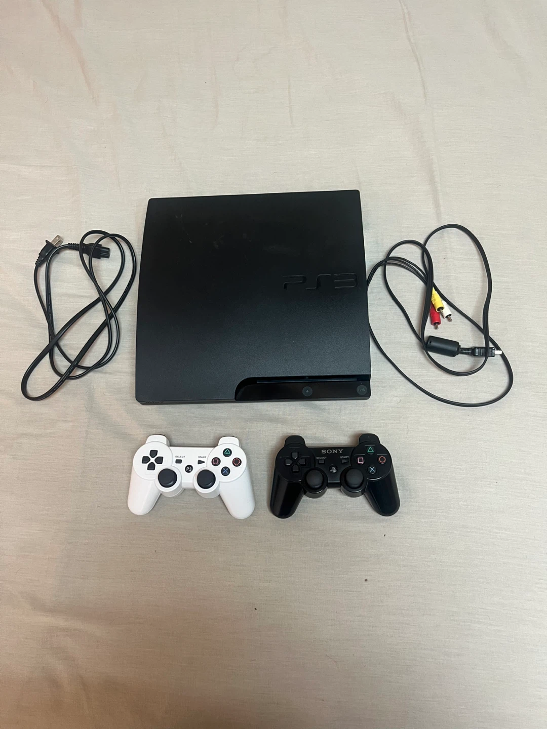 Sony PlayStation 3 Console with 2 Controllers and 8 Games