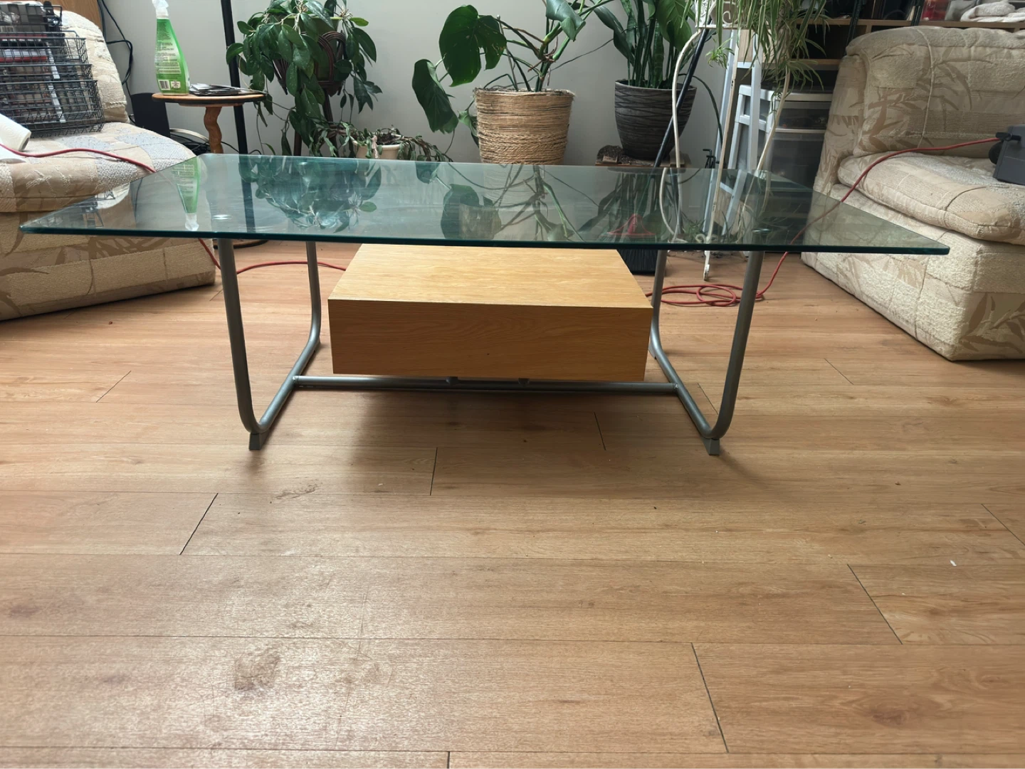 Glass top coffee table with wood drawer