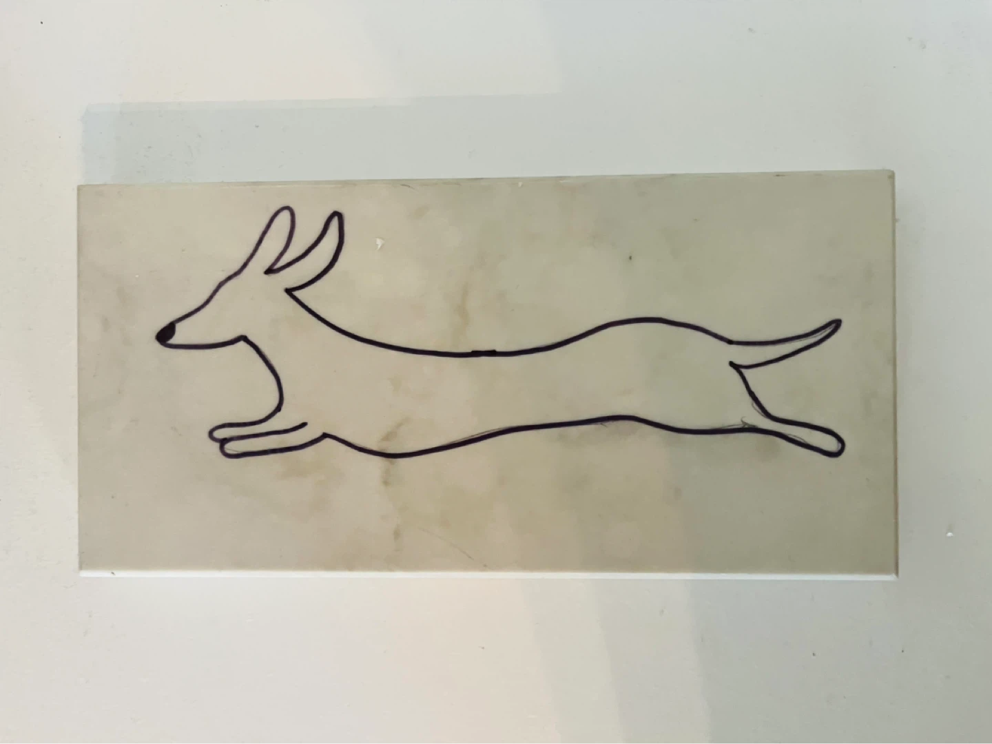 Hand-drawn Dog Art on Stone Block