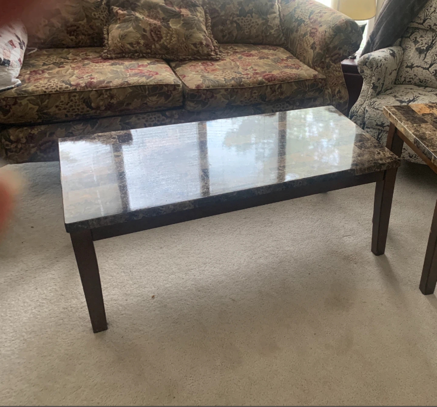 Marble top coffee table with dark wood base