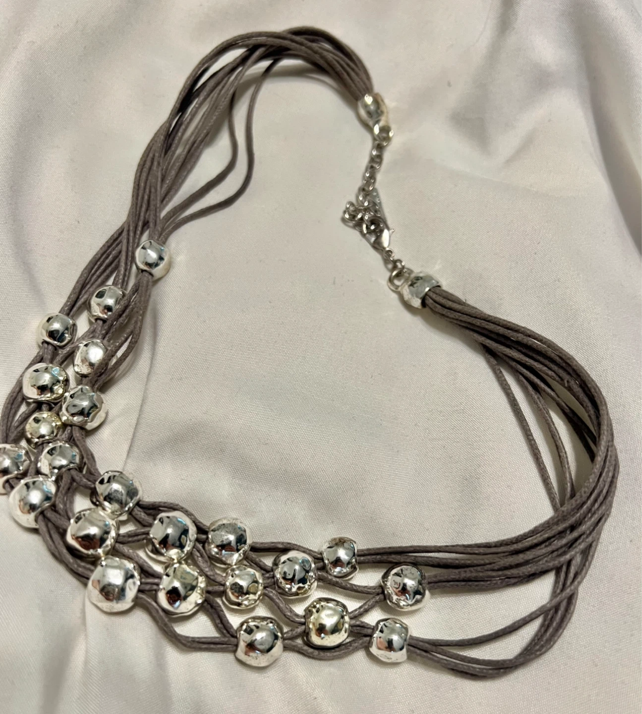Multi-strand necklace with silver beads
