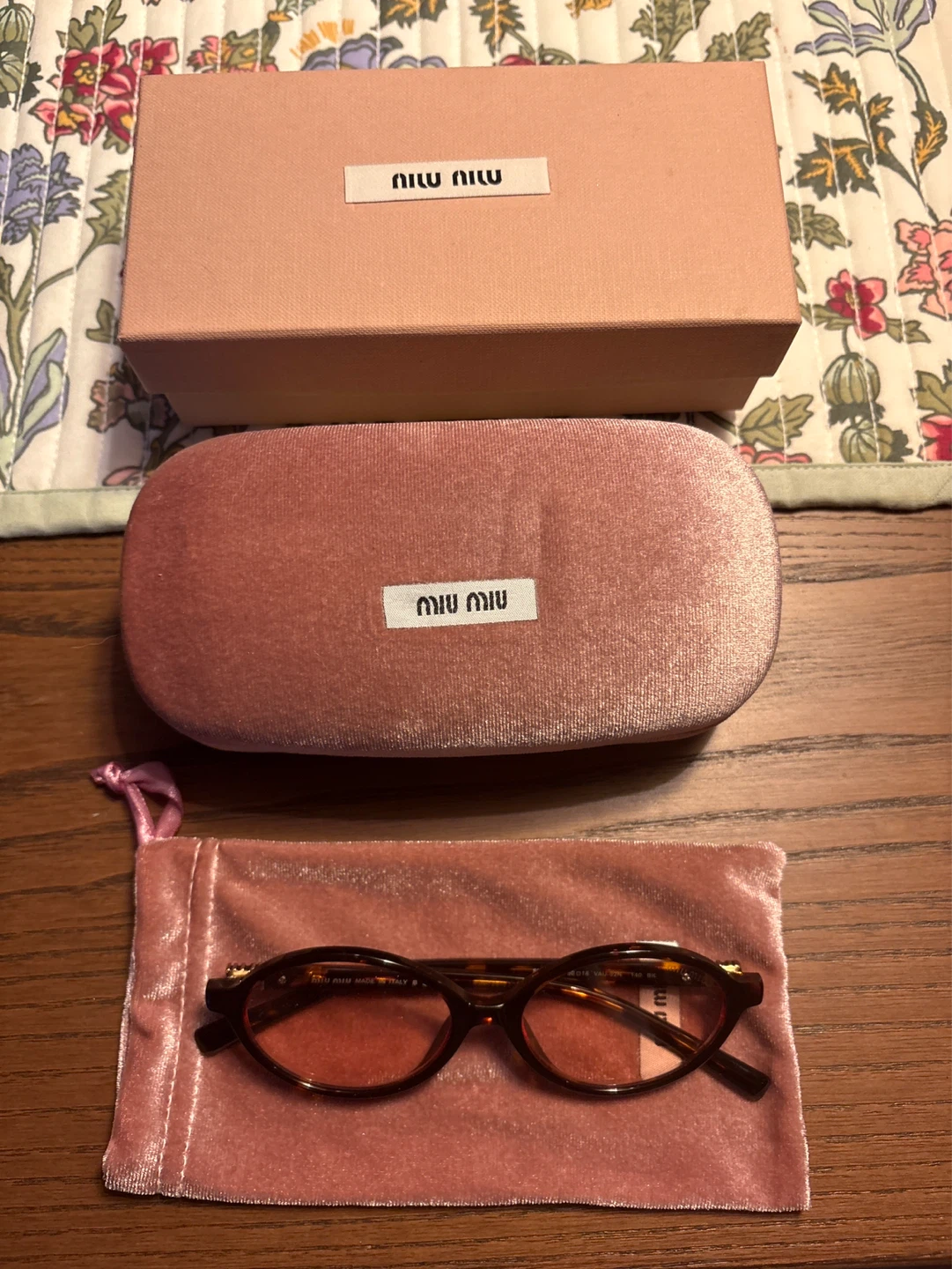 Miu Miu Oval Sunglasses