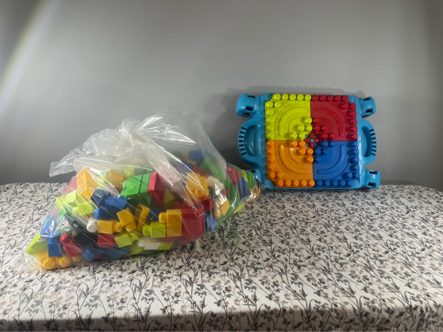 Bag of colourful building blocks with baseplate