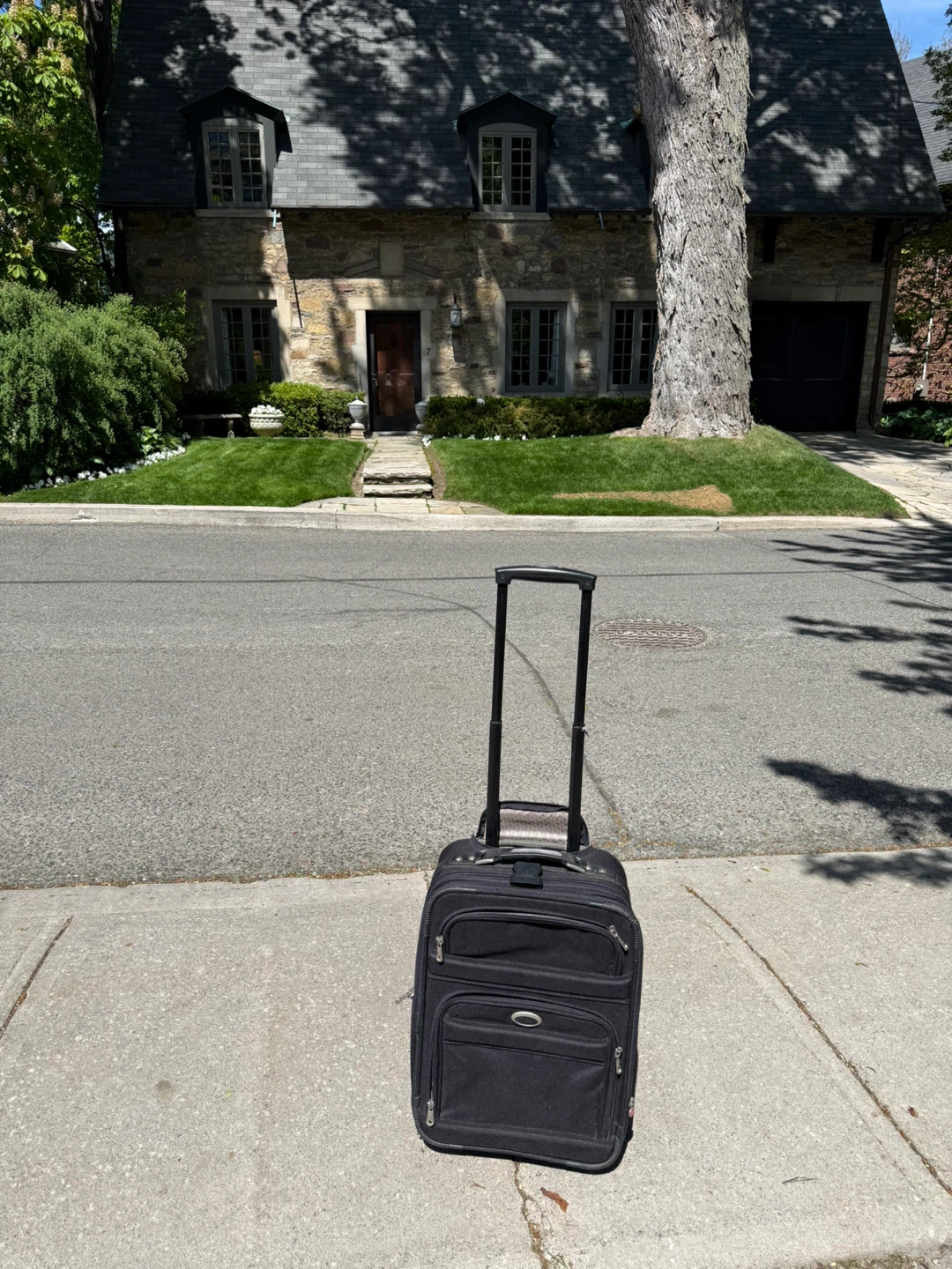 Black Rolling Suitcase with Telescopic Handle