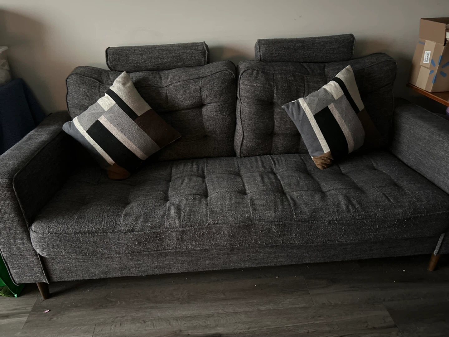 Dark Grey Tufted Sofa with Decorative Pillows