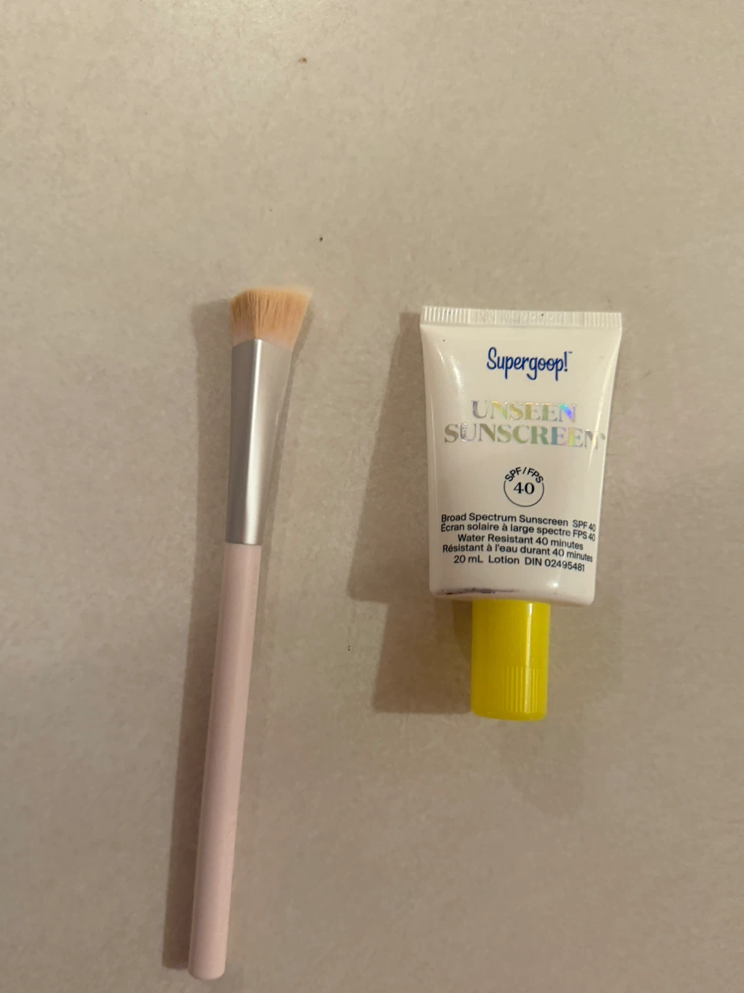 Supergoop Sunscreen SPF 40 and Kylie Jenner concealer brush