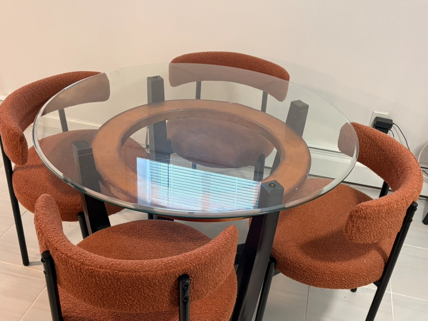 Round Glass Top Dining Table with 4 Orange Boucle Chairs