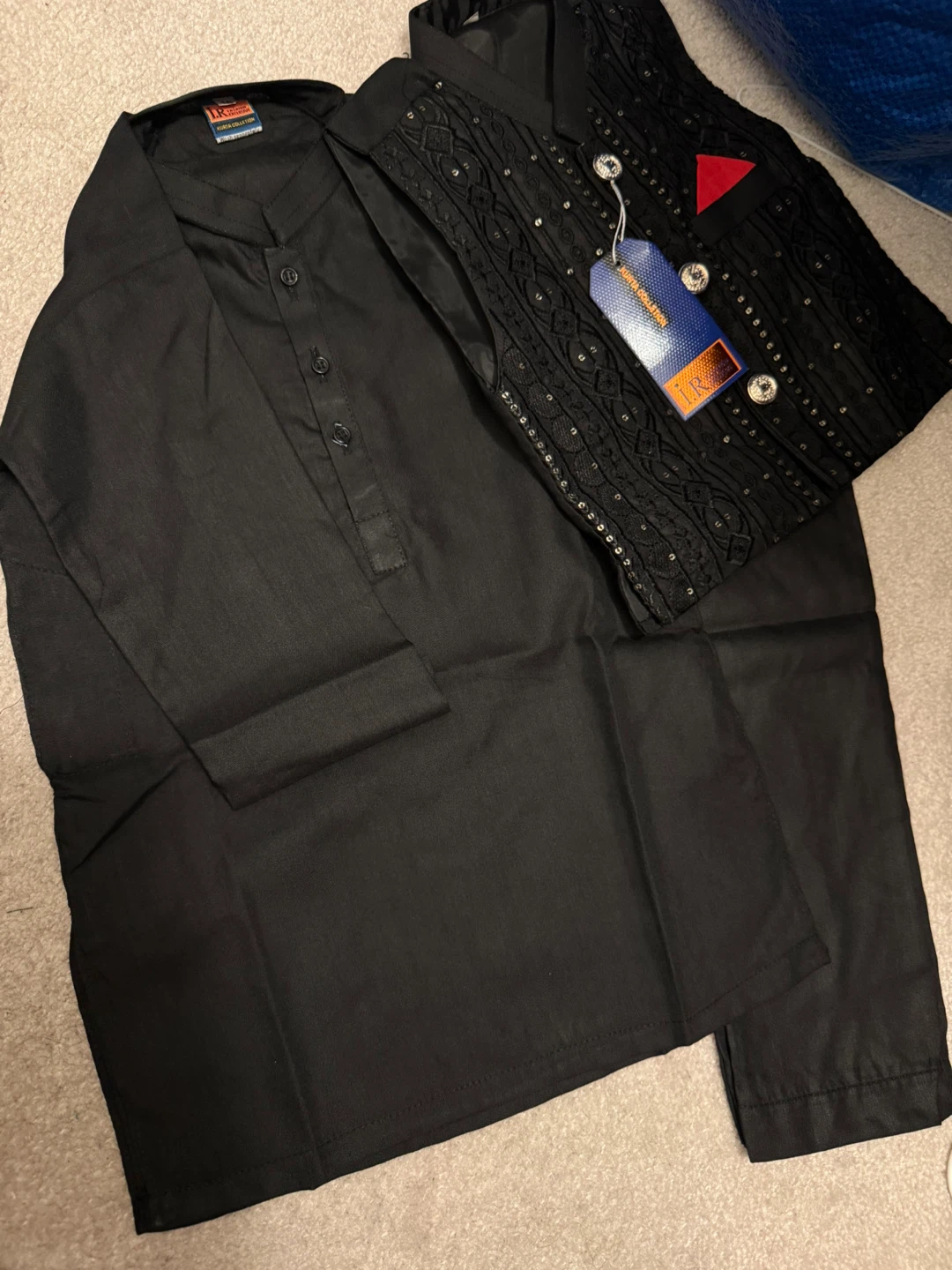 Black kurta pajama set with embellished vest