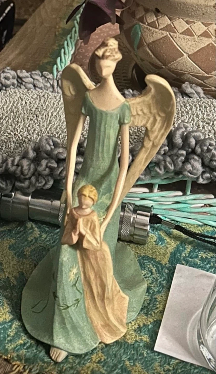 Angel figurine with child