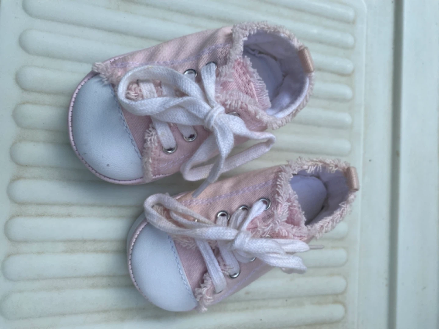 Baby shoes (pink sneakers and black crocs)