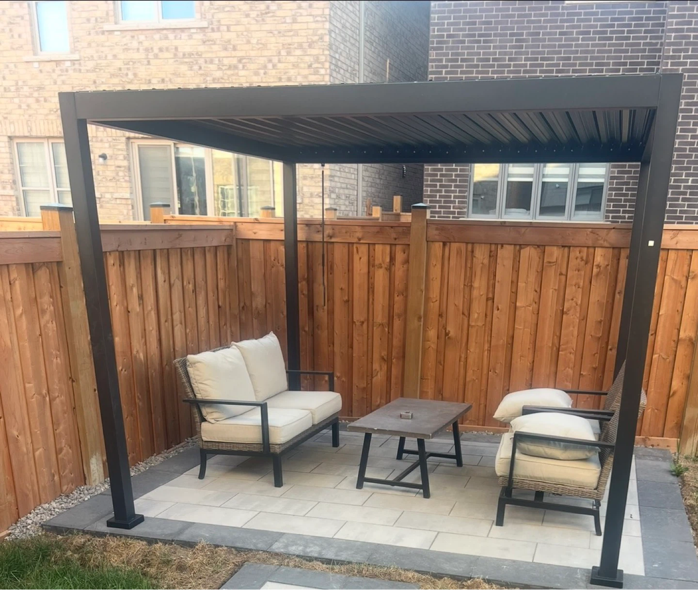 Outdoor patio set with chairs, sofa, and table