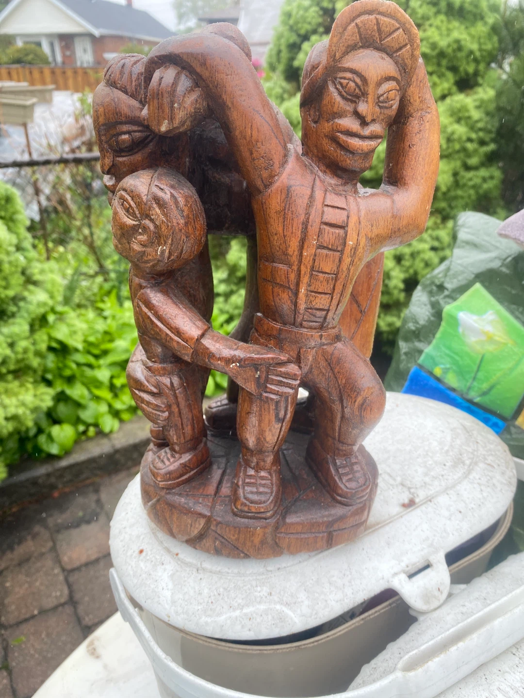 Carved wooden family sculpture