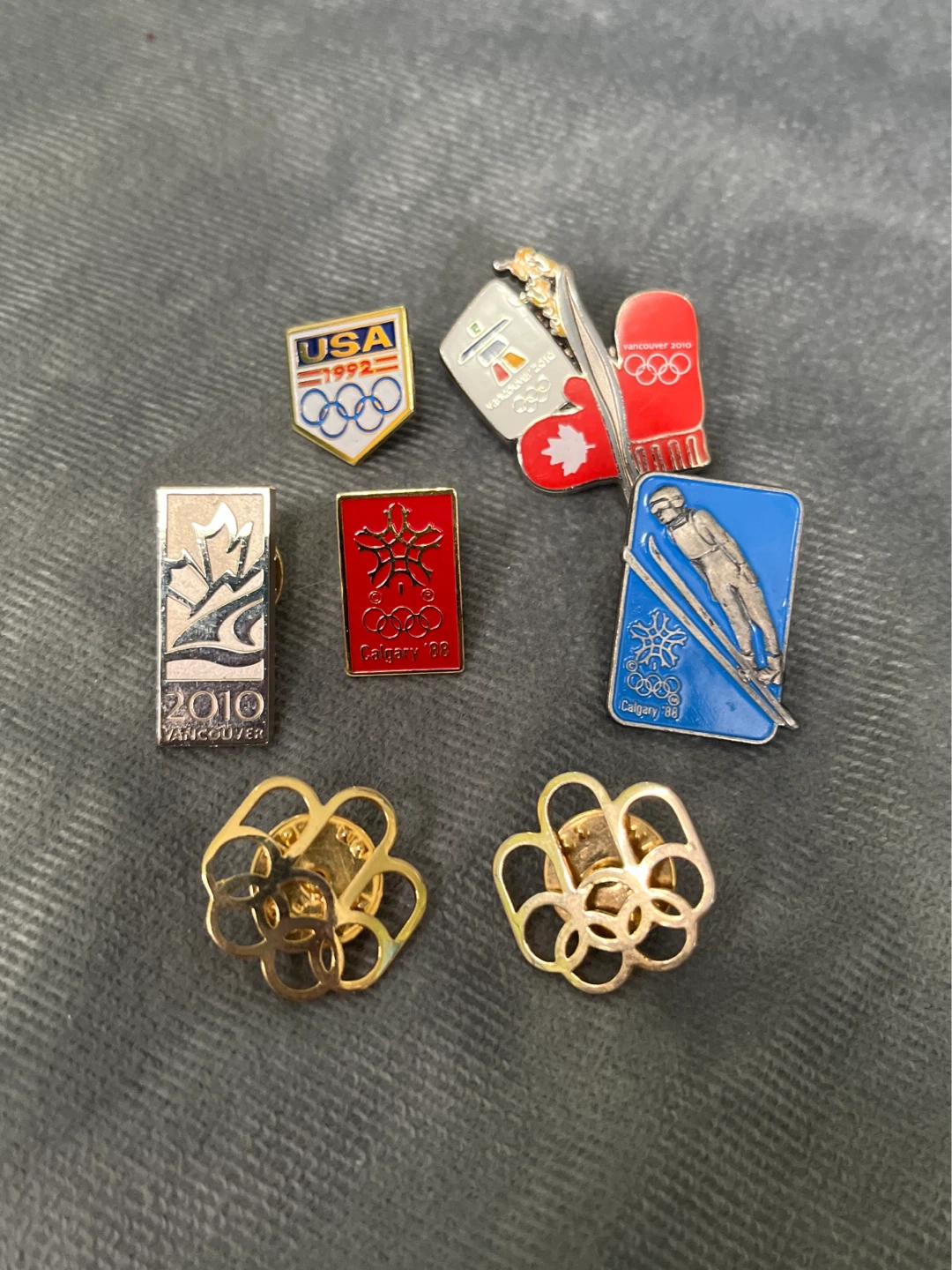 Lot of 7 Olympic pins (Vancouver, Calgary, USA)