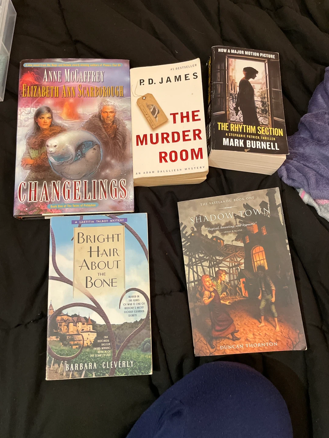 3 Paperback Books and 1 hard cover