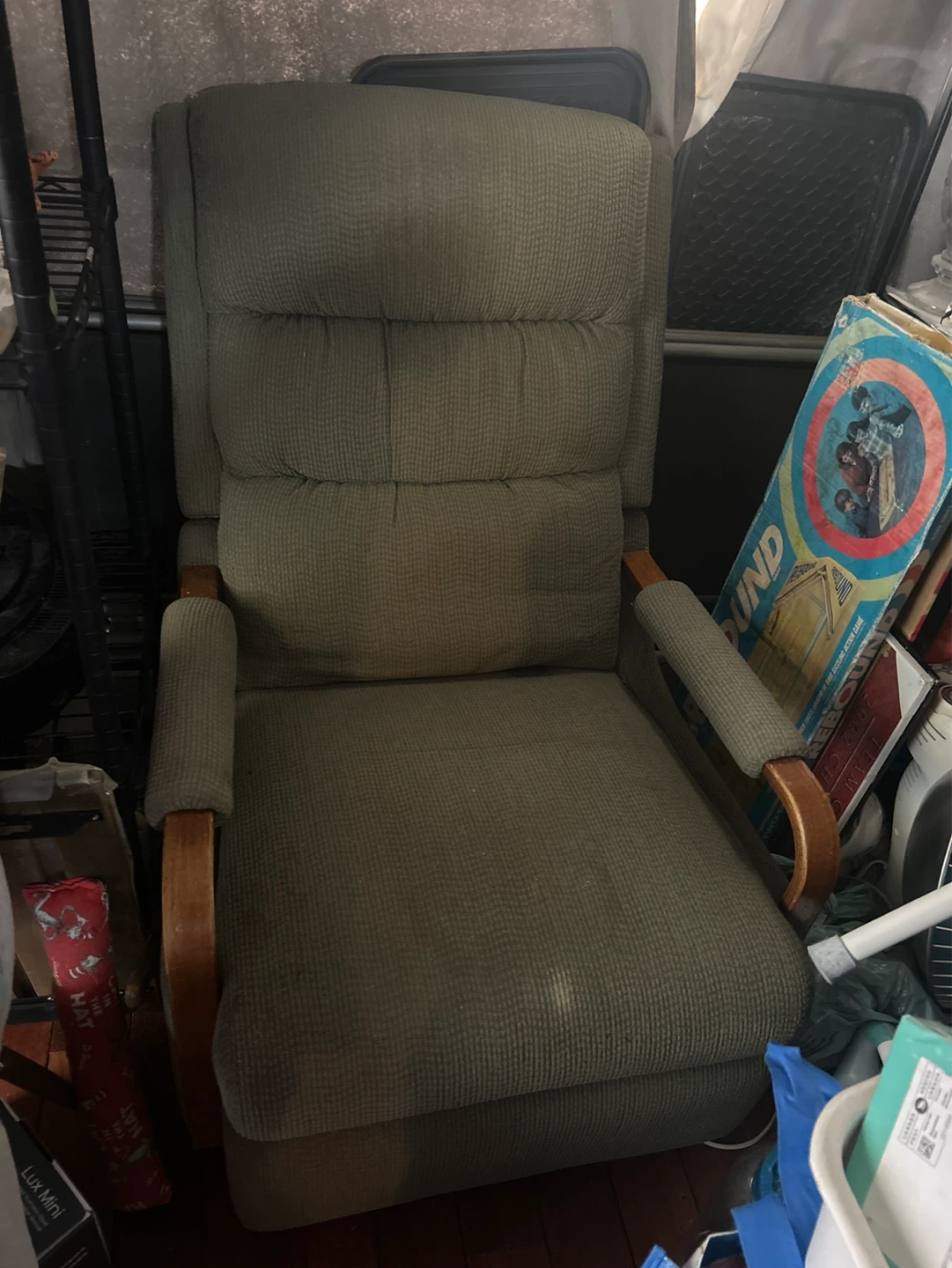 Green upholstered recliner chair