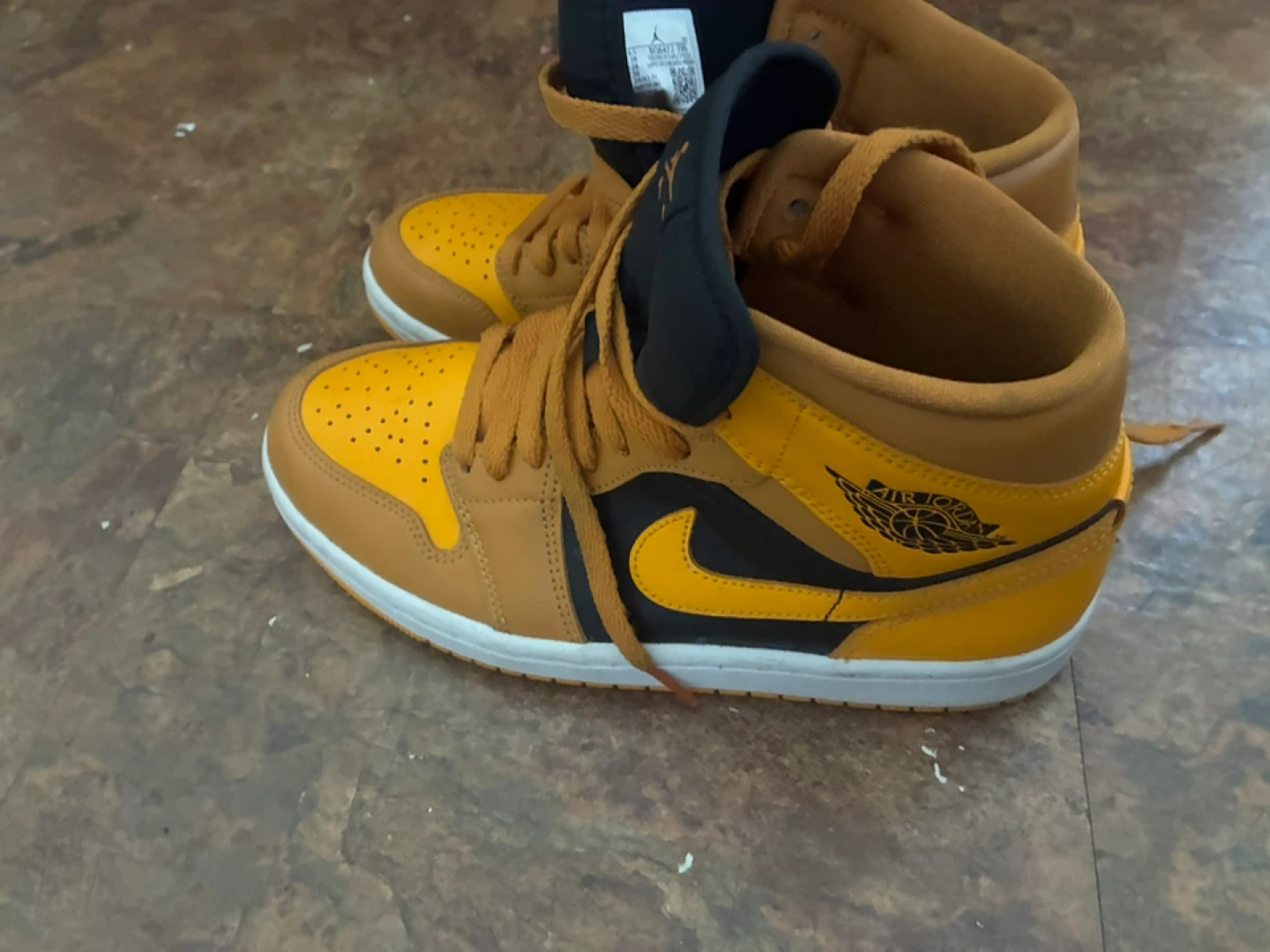 Nike Air Jordan 1 Mid sneakers in the "Chutney" colorway.