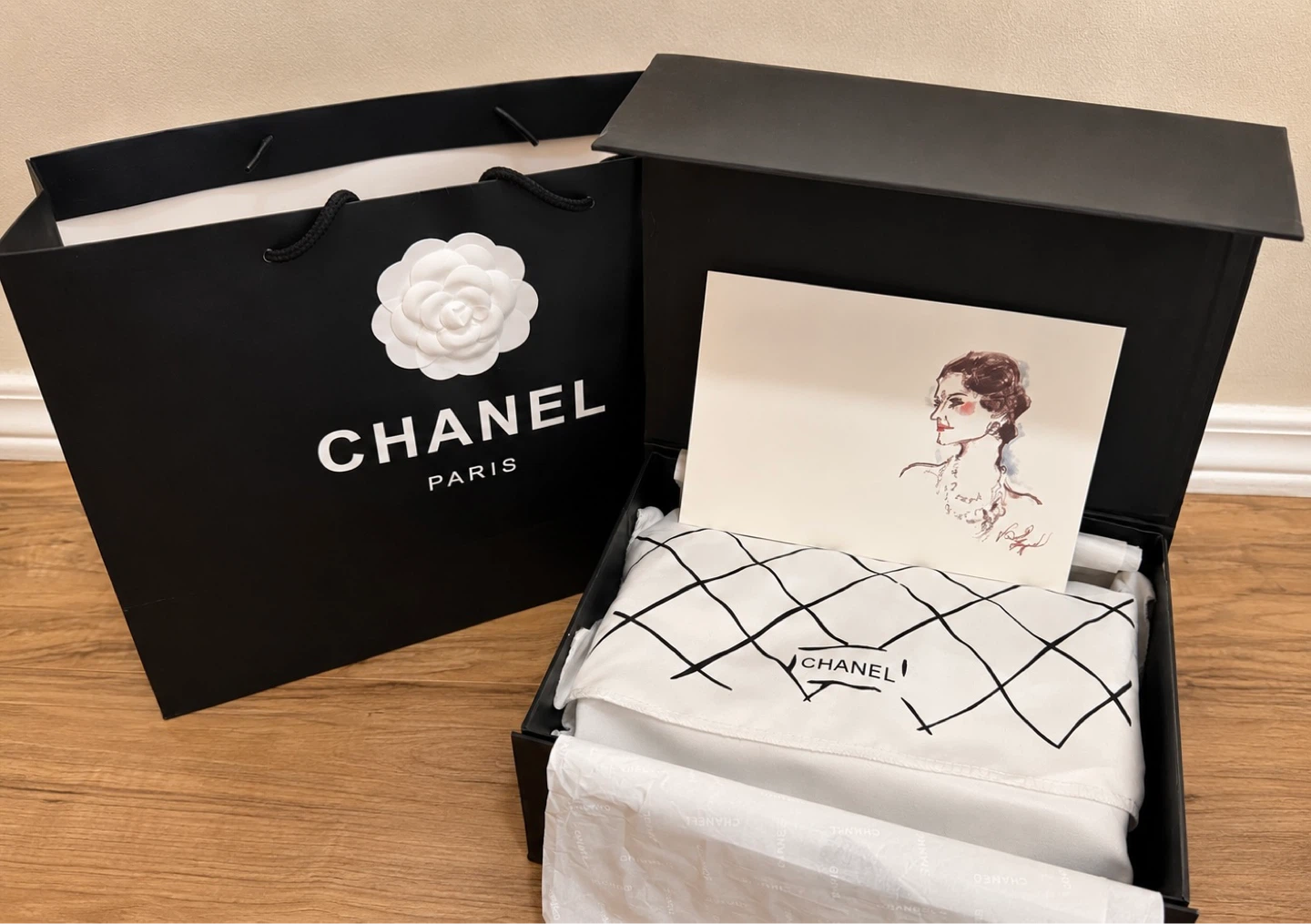 CHANEL Black Quilted Lambskin Classic Handbag