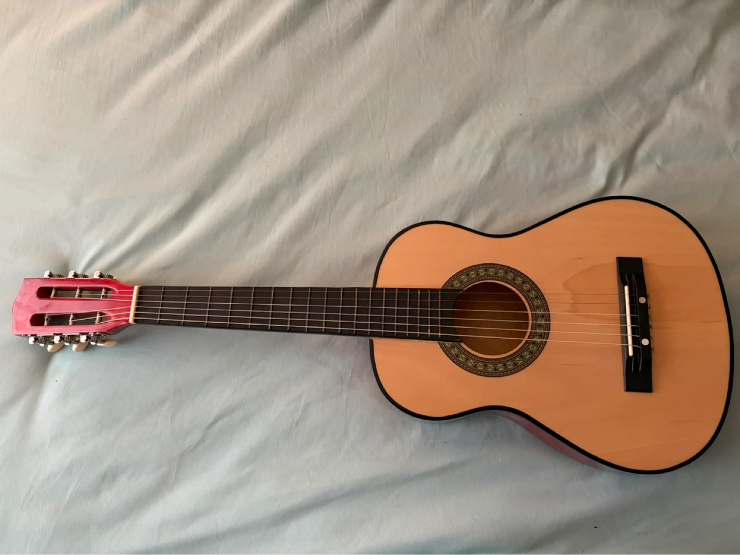 Acoustic Guitar with Red Headstock