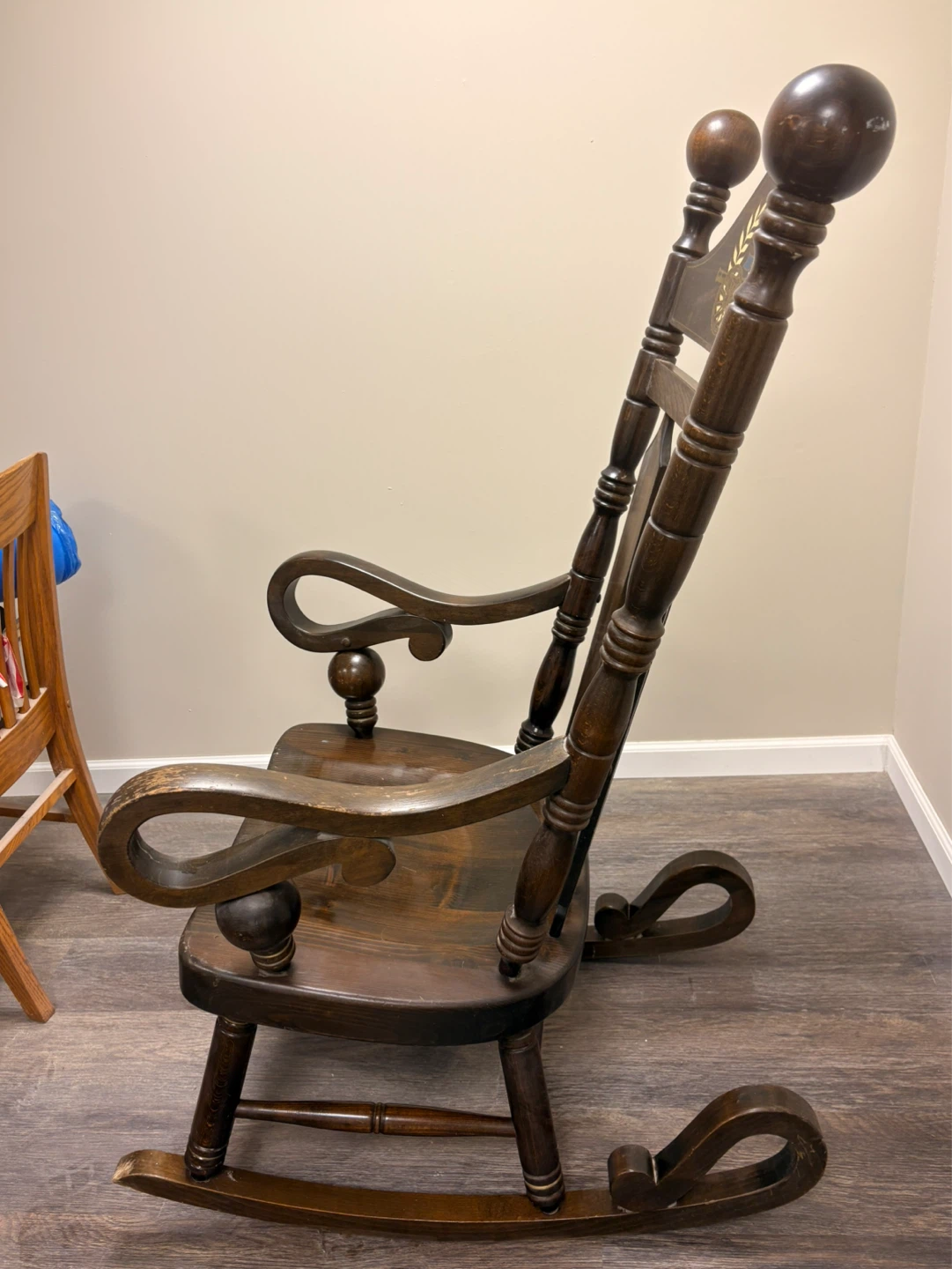 Antique Wooden Rocking Chair with Decorative Emblem - photo 3