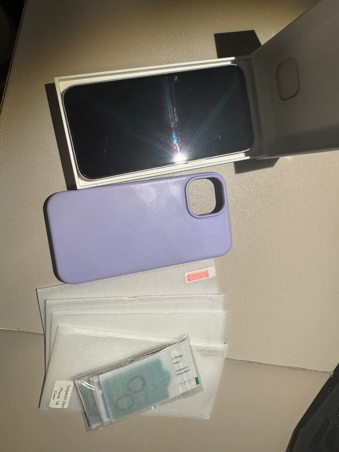iPhone 14 with Case and Screen Protectors