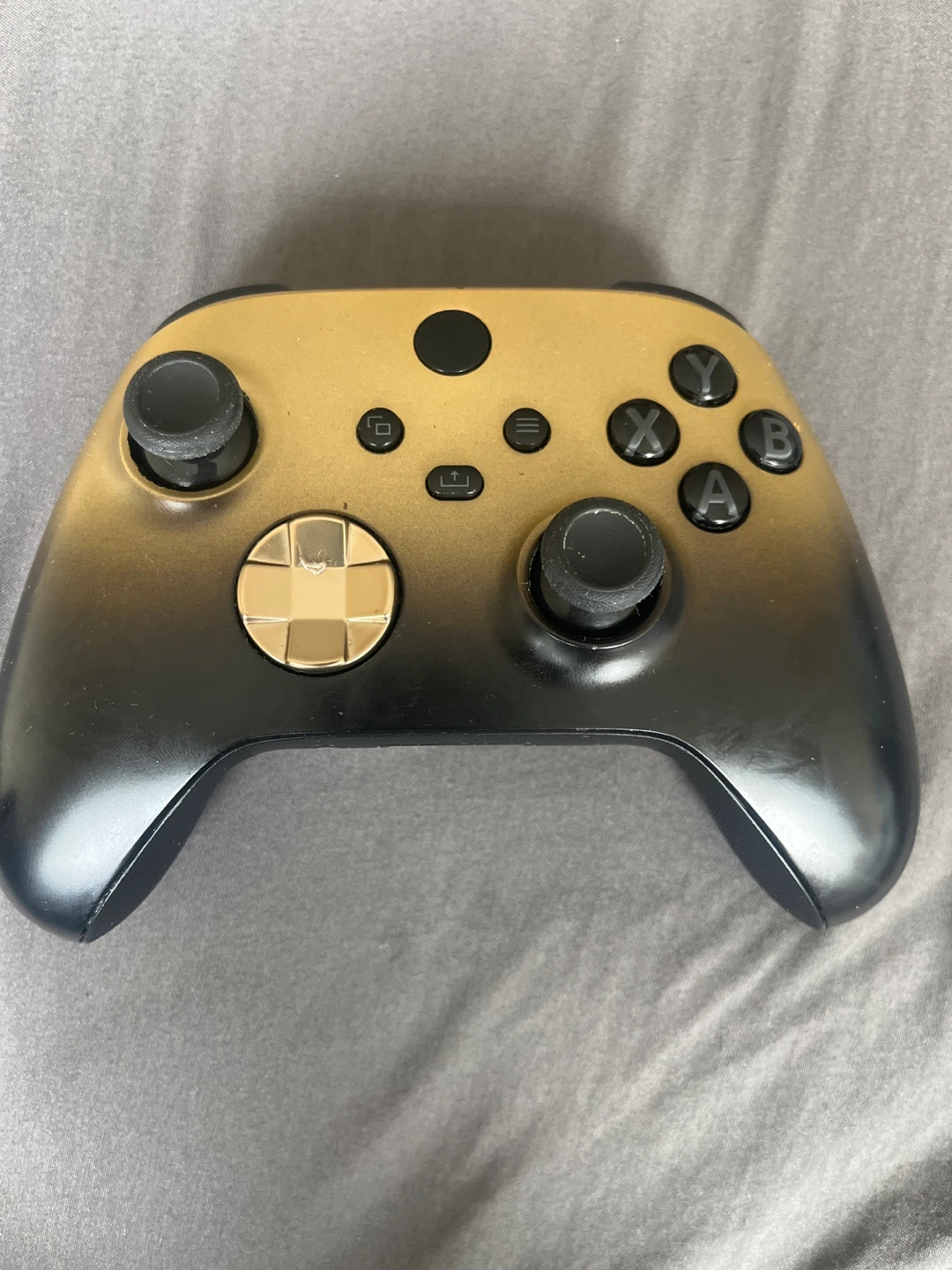 Gold and Black Xbox Controller