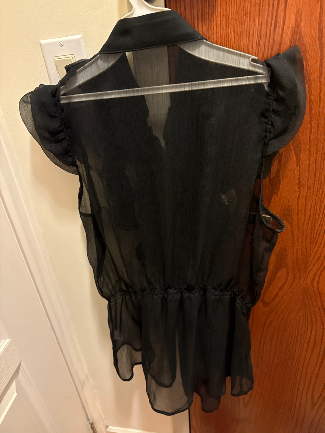 Black sheer ruffled sleeveless blouse - photo 2