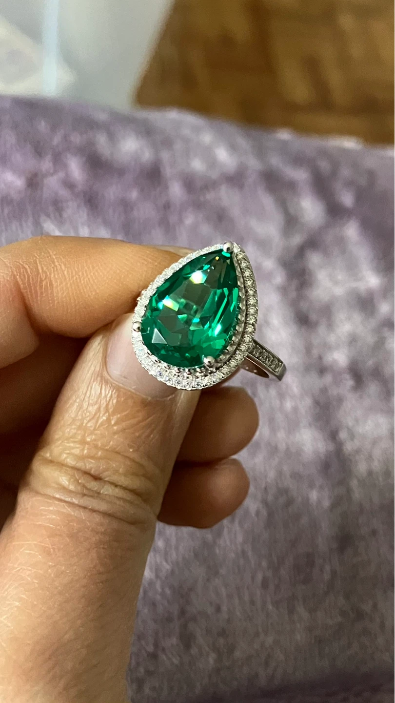 Pear-cut Emerald and Diamond Halo Ring