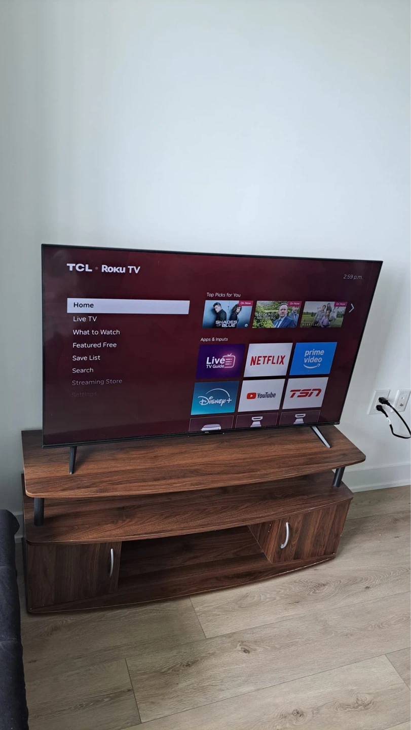 TCL Roku TV and TV stand